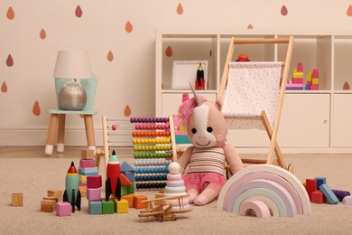 Many different toys on floor in child's room