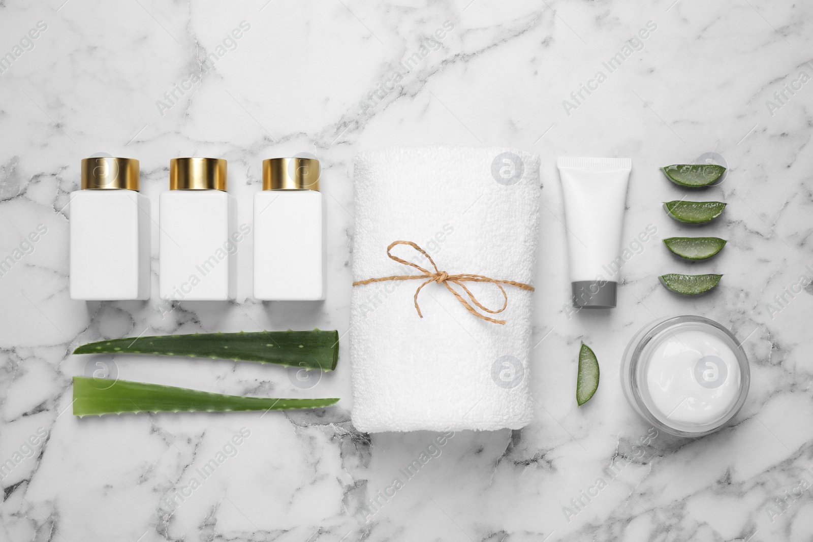 Photo of Flat lay composition with aloe vera and cosmetic products on white marble background