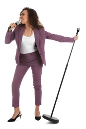 Photo of Curly African-American woman in suit singing with microphone on white background