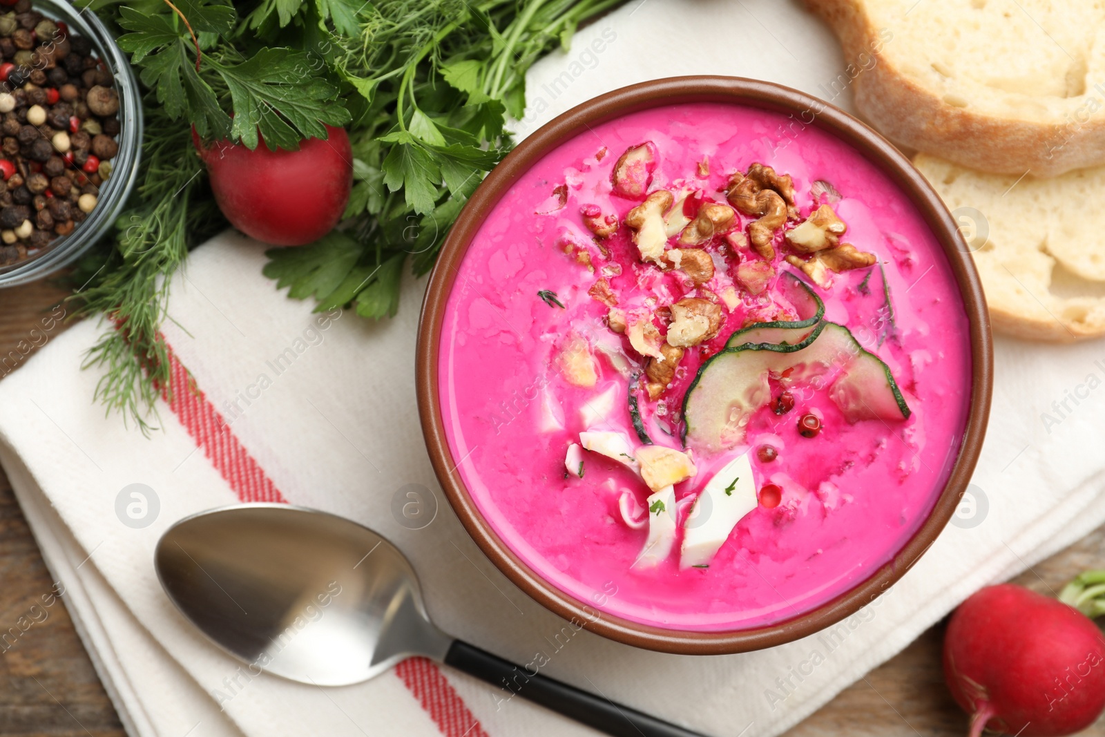 Photo of Delicious cold summer beet soup on table, flat lay