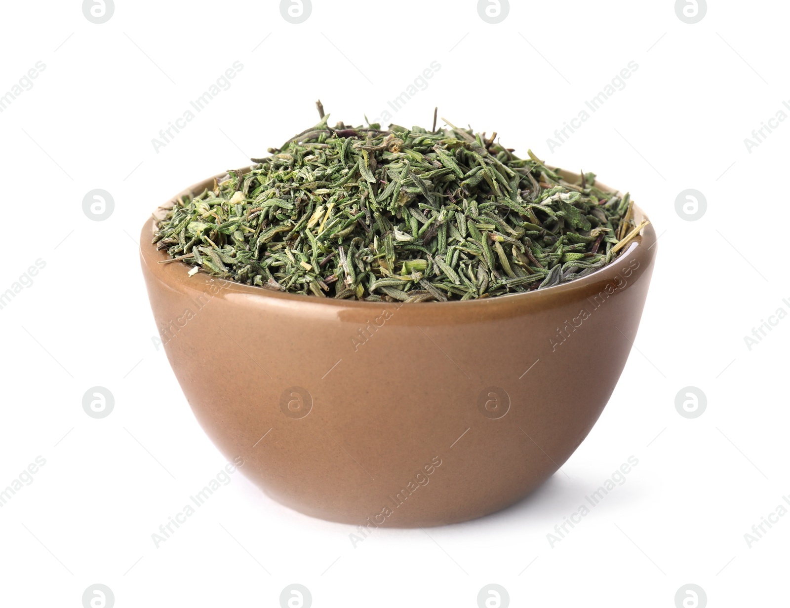 Photo of Bowl of dried thyme isolated on white