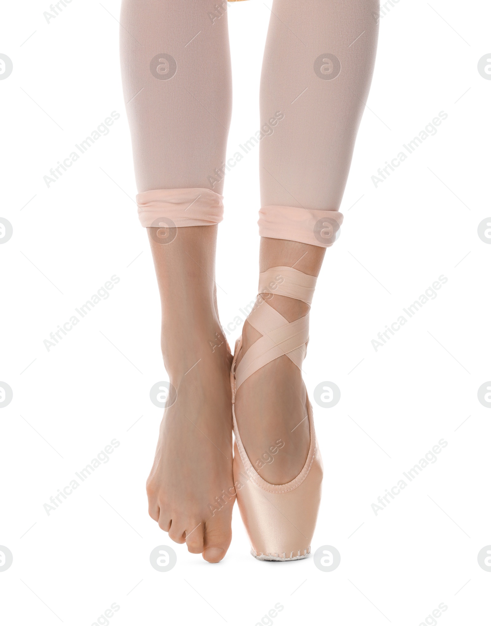 Photo of Ballerina in pointe shoe dancing on white background, closeup