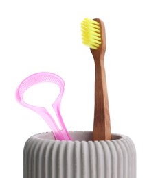 Photo of Holder with tongue cleaner and toothbrush on white background