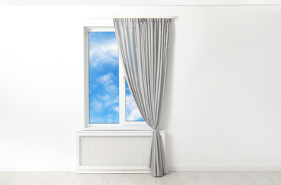 Image of Beautiful view on blue sky with clouds through window in room