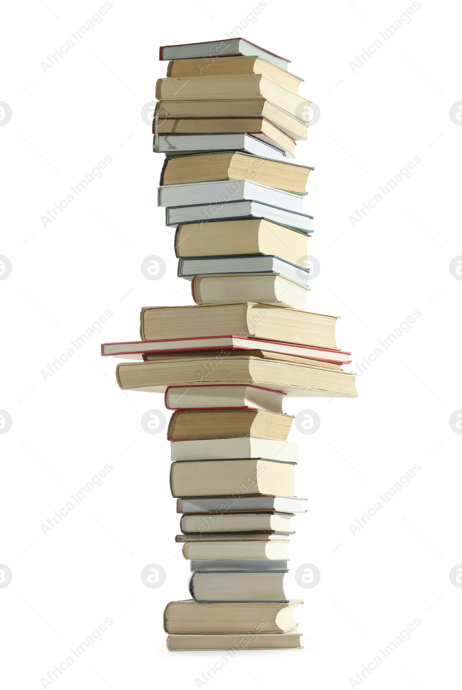 Photo of High stack of many different books isolated on white