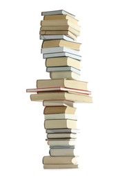 Photo of High stack of many different books isolated on white