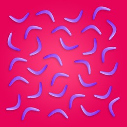Color boomerangs on pink background, flat lay
