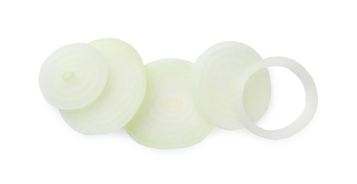 Slices of raw onion on white background, top view