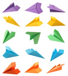 Image of Set with handmade different color paper planes on white background