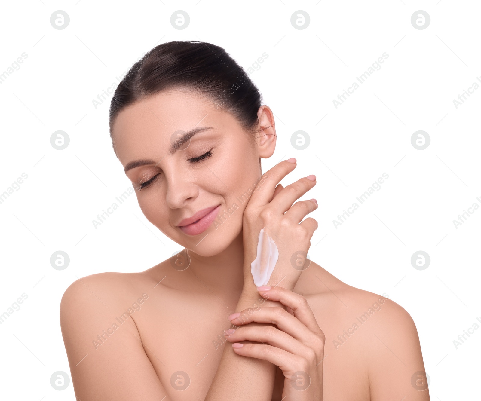 Photo of Beautiful woman with smear of body cream on her hand against white background