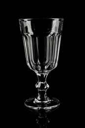 Photo of Clean empty cocktail glass on black background