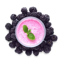 Glass of blackberry smoothie with mint and berries on white background, top view