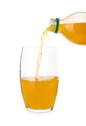 Photo of Pouring delicious orange soda water from bottle into glass on white background