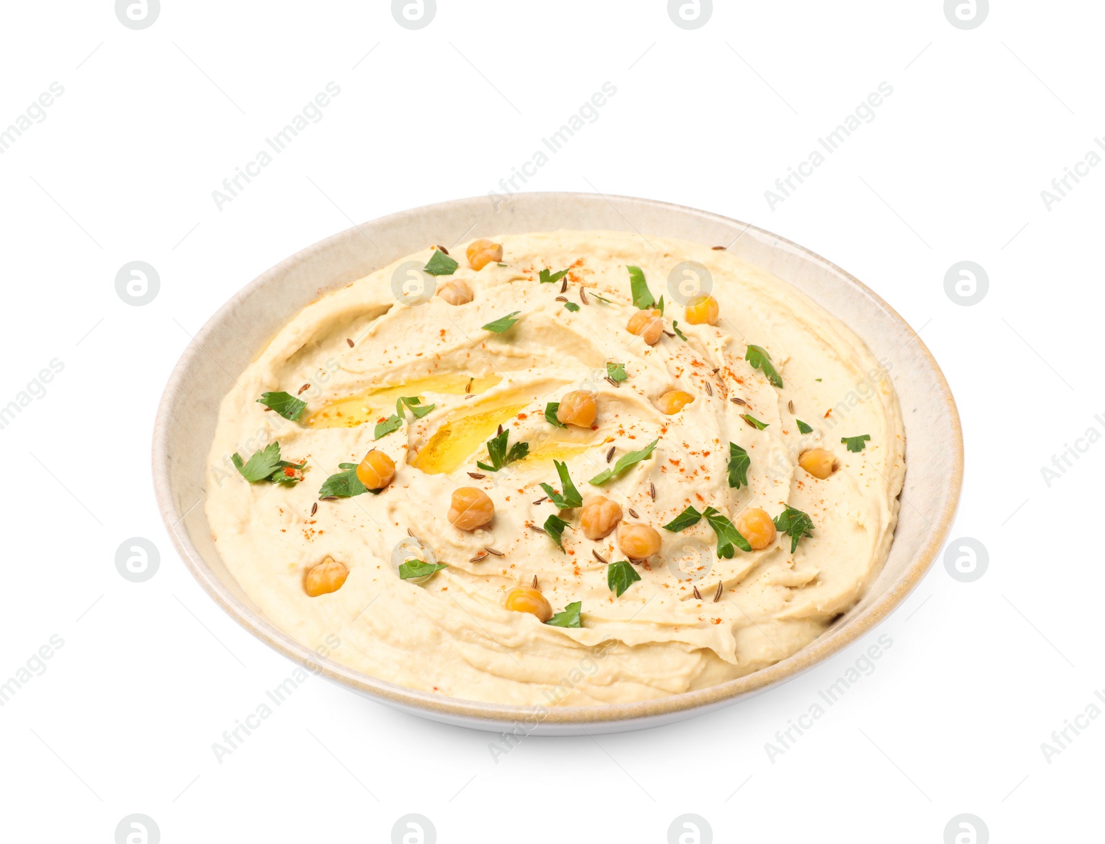 Tasty hummus with garnish in bowl isolated on white Photo of Tasty hummus with garnish in bowl isolated on white