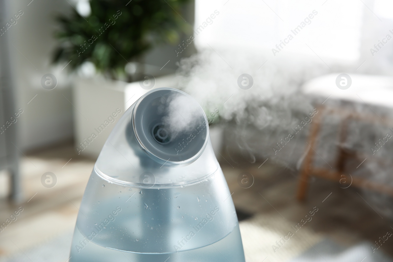 Photo of Modern air humidifier at home, closeup view