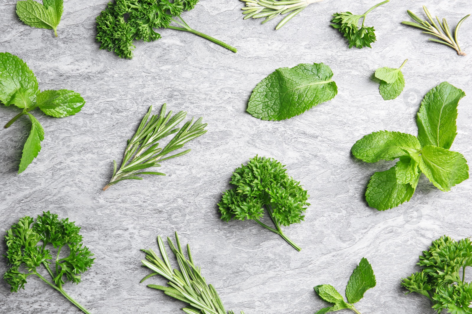 Photo of Flat lay composition with rosemary on table. Aromatic herbs