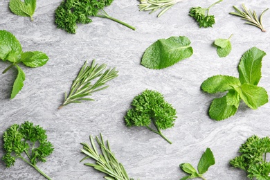 Flat lay composition with rosemary on table. Aromatic herbs