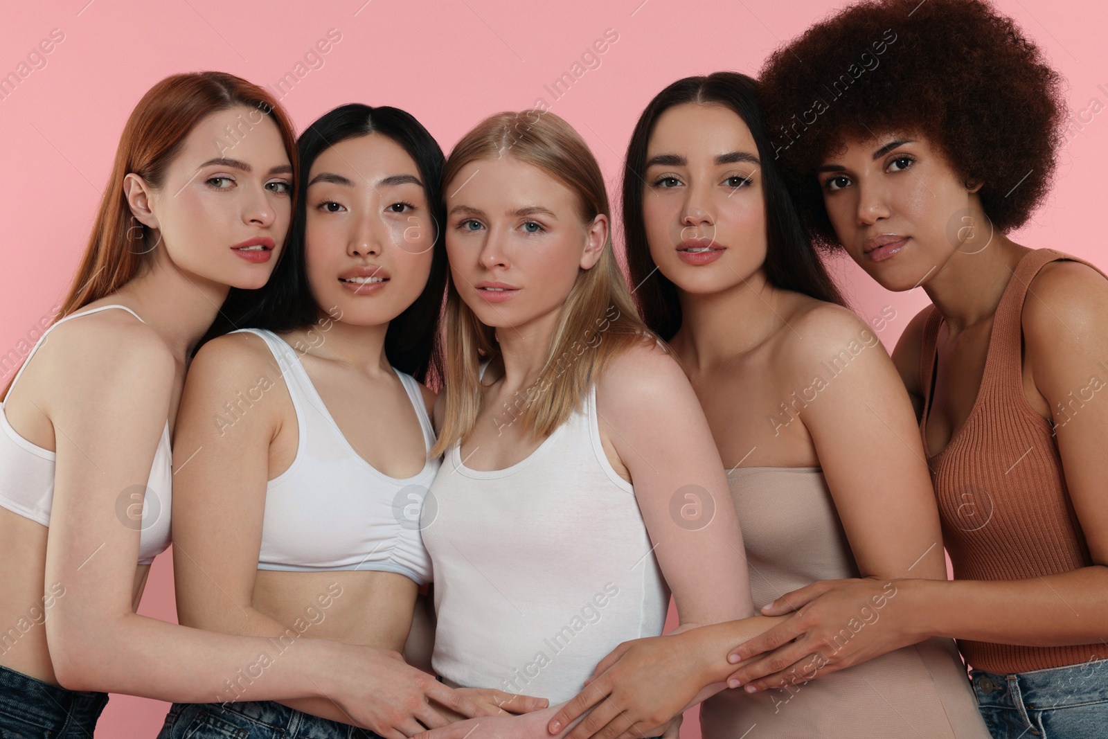 Photo of Portrait of beautiful young women on pink background