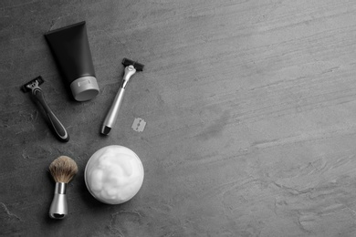 Photo of Flat lay composition with men's cosmetic products on grey background. Space for design