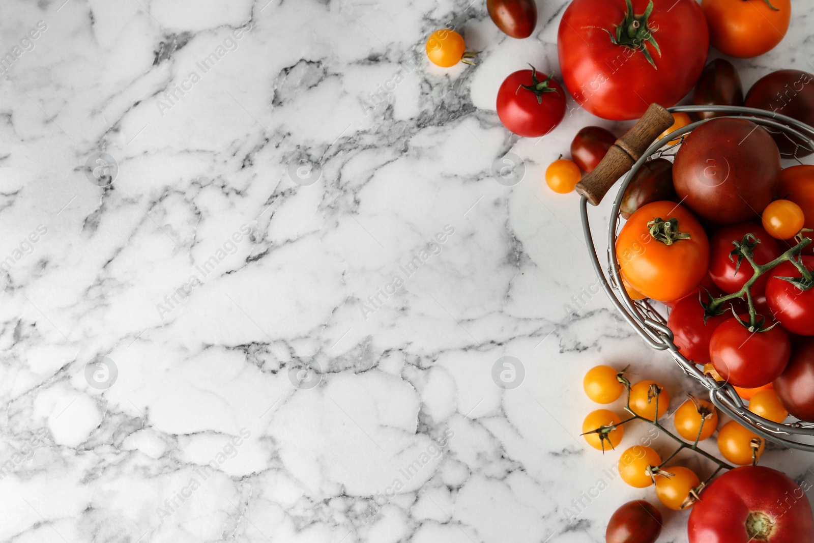 Photo of Flat lay composition with fresh ripe tomatoes on marble table, space for text