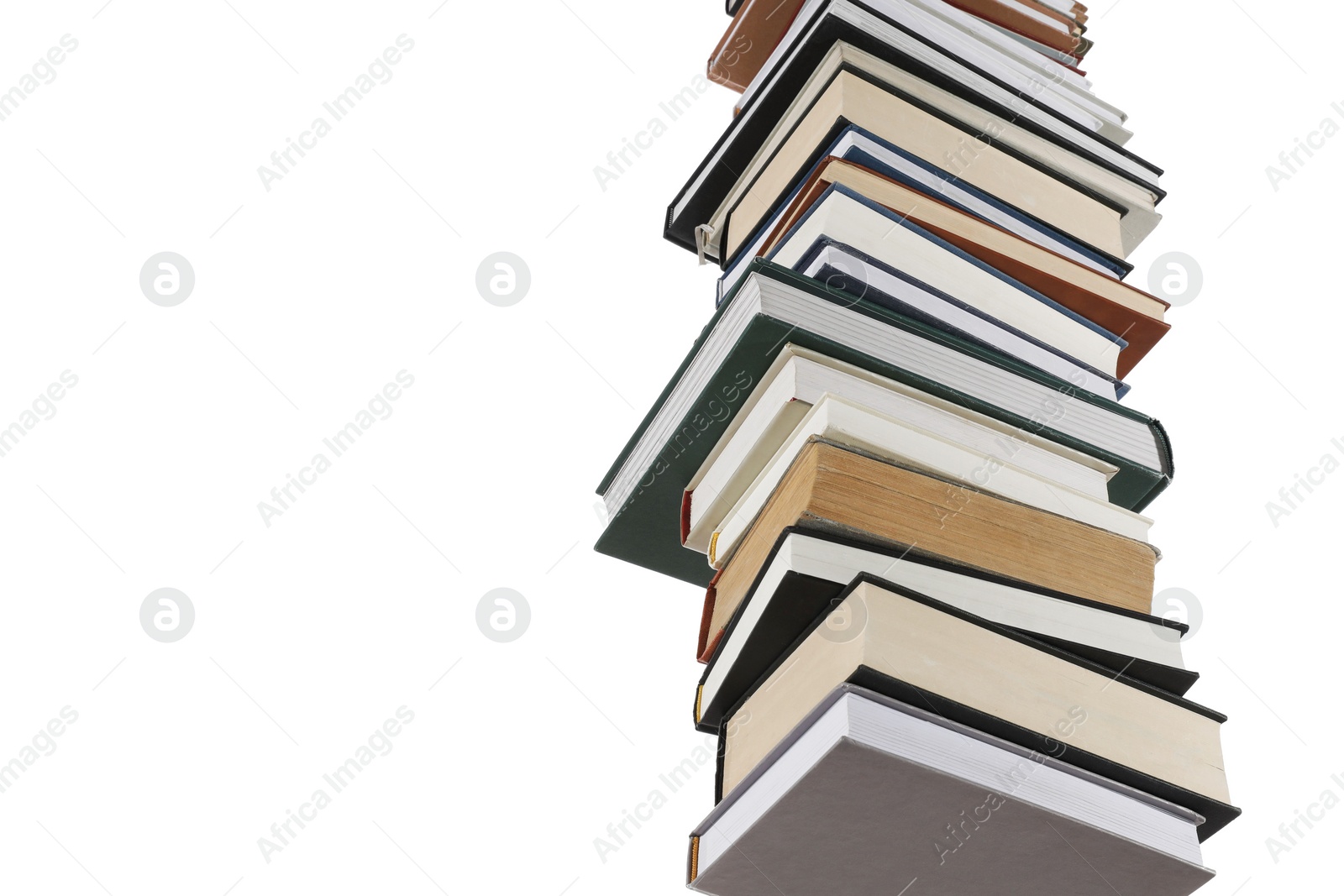 Photo of Stack of many different books isolated on white, low angle view