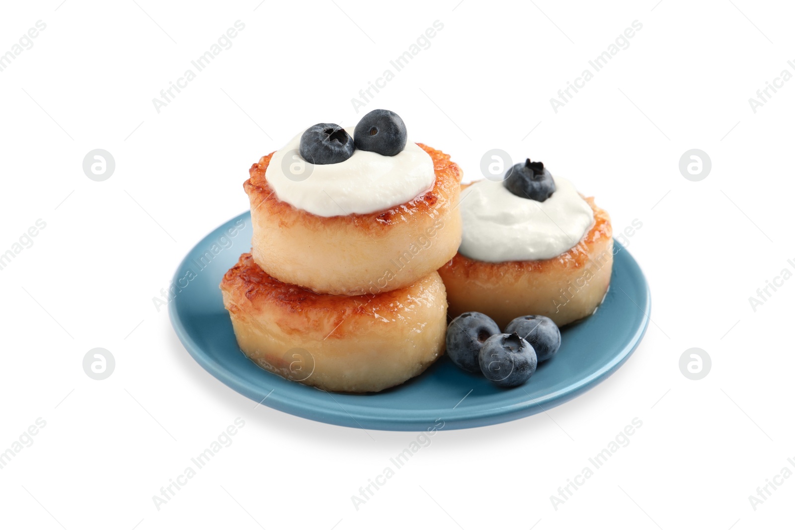 Photo of Delicious cottage cheese pancakes with blueberries, honey and sour cream on white background