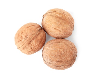 Photo of Walnuts in shell on white background, top view