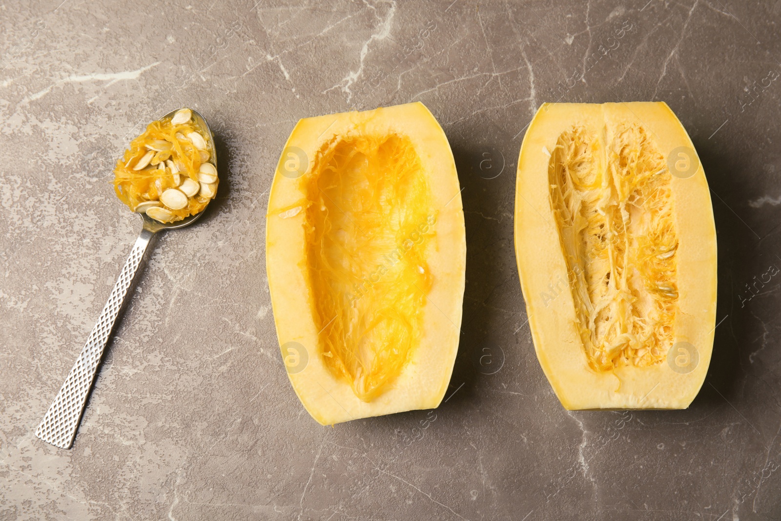 Photo of Flat lay composition with cut spaghetti squash on gray table