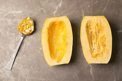 Photo of Flat lay composition with cut spaghetti squash on gray table