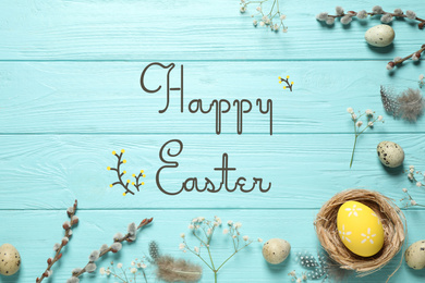 Image of Flat lay composition with text Happy Easter and eggs on light blue wooden background