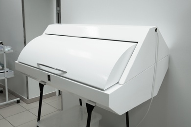 Photo of Closed ultraviolet sterilizer for medical instruments in modern clinic