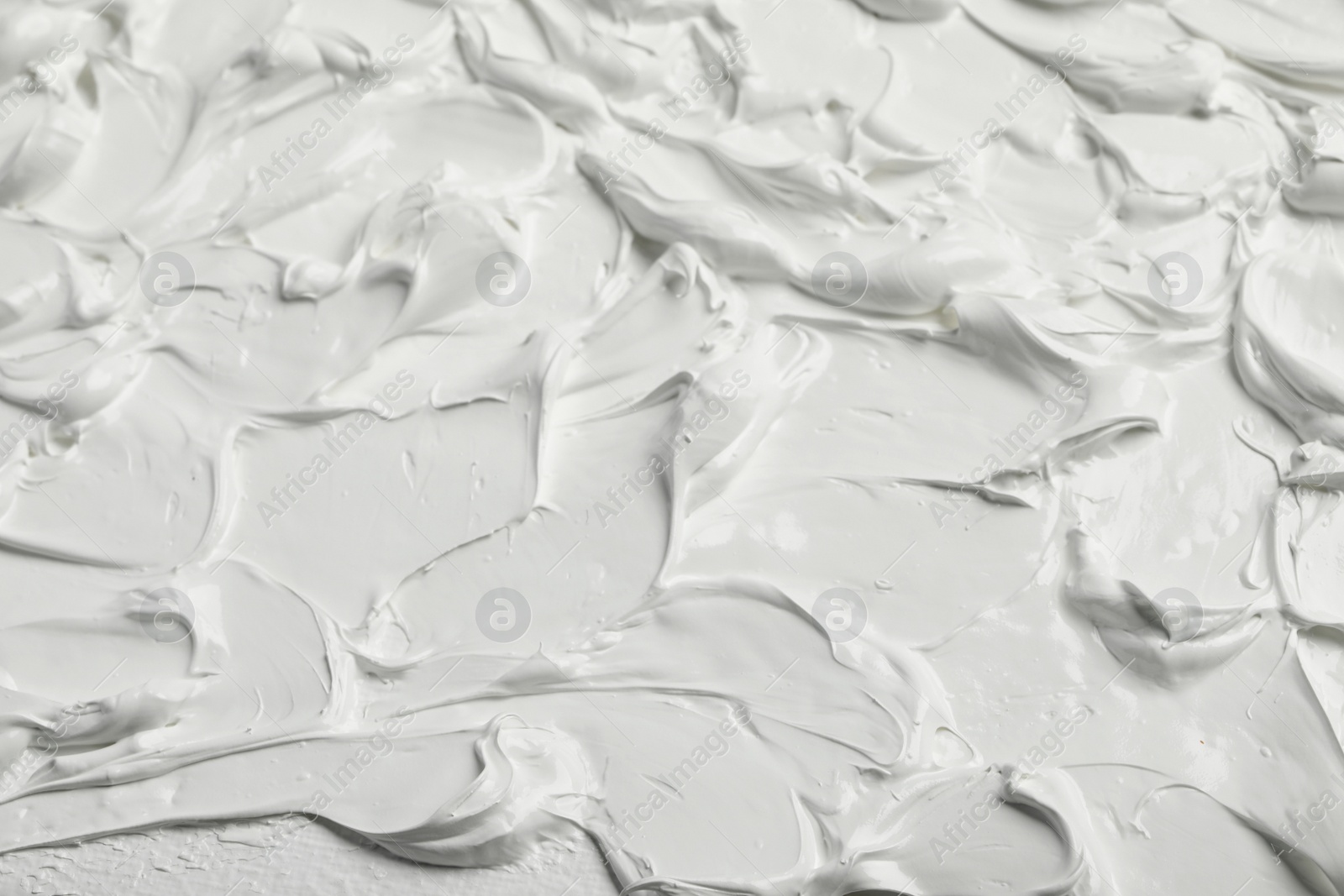 Photo of Texture of white oil paint as background, closeup