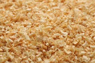 Photo of Dry natural sawdust as background, closeup view