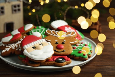Different tasty Christmas cookies on wooden table, closeup. Space for text