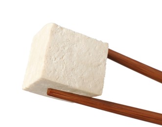 Photo of Chopsticks with delicious raw tofu cube isolated on white