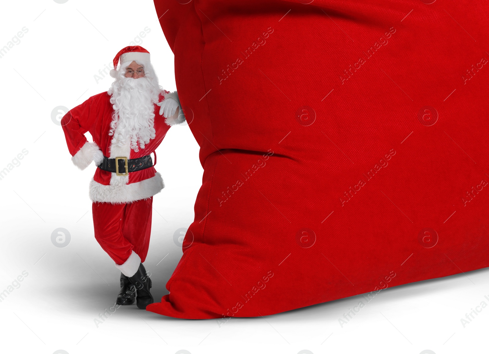 Image of Santa Claus with big red bag full of Christmas presents on white background