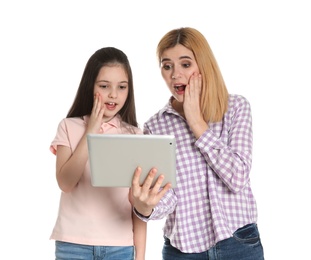Mother and her daughter using video chat on tablet against white background
