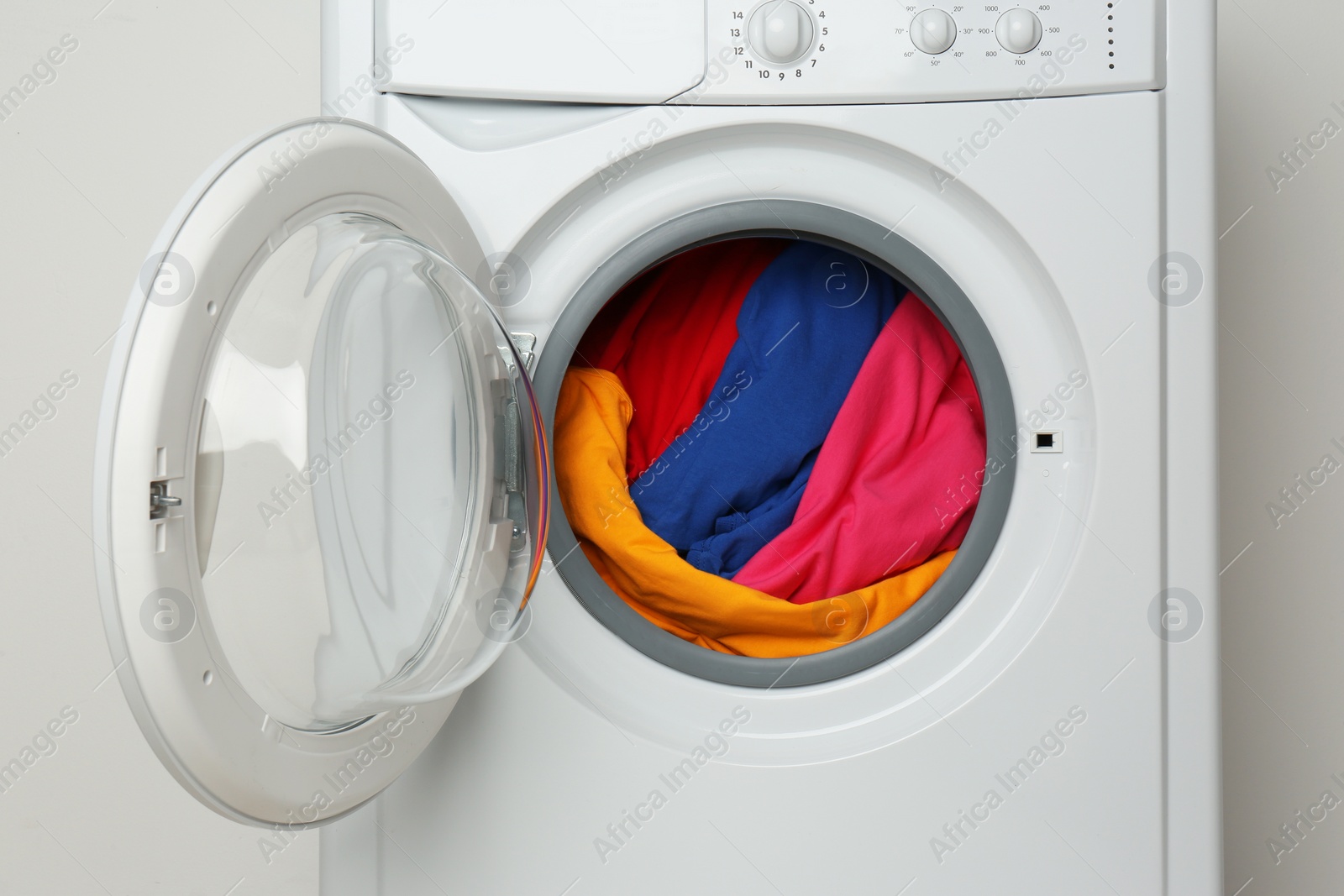 Photo of Modern washing machine on white background. Laundry day
