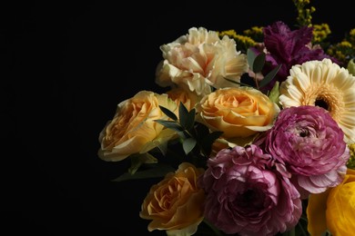 Photo of Beautiful fresh flowers on dark background, closeup