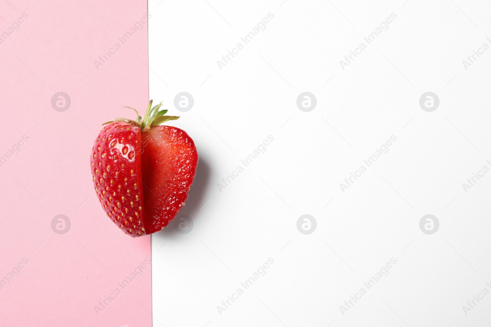 Photo of Fresh ripe strawberry on color background, top view