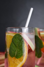 Glass of tasty rhubarb cocktail with lemon, closeup