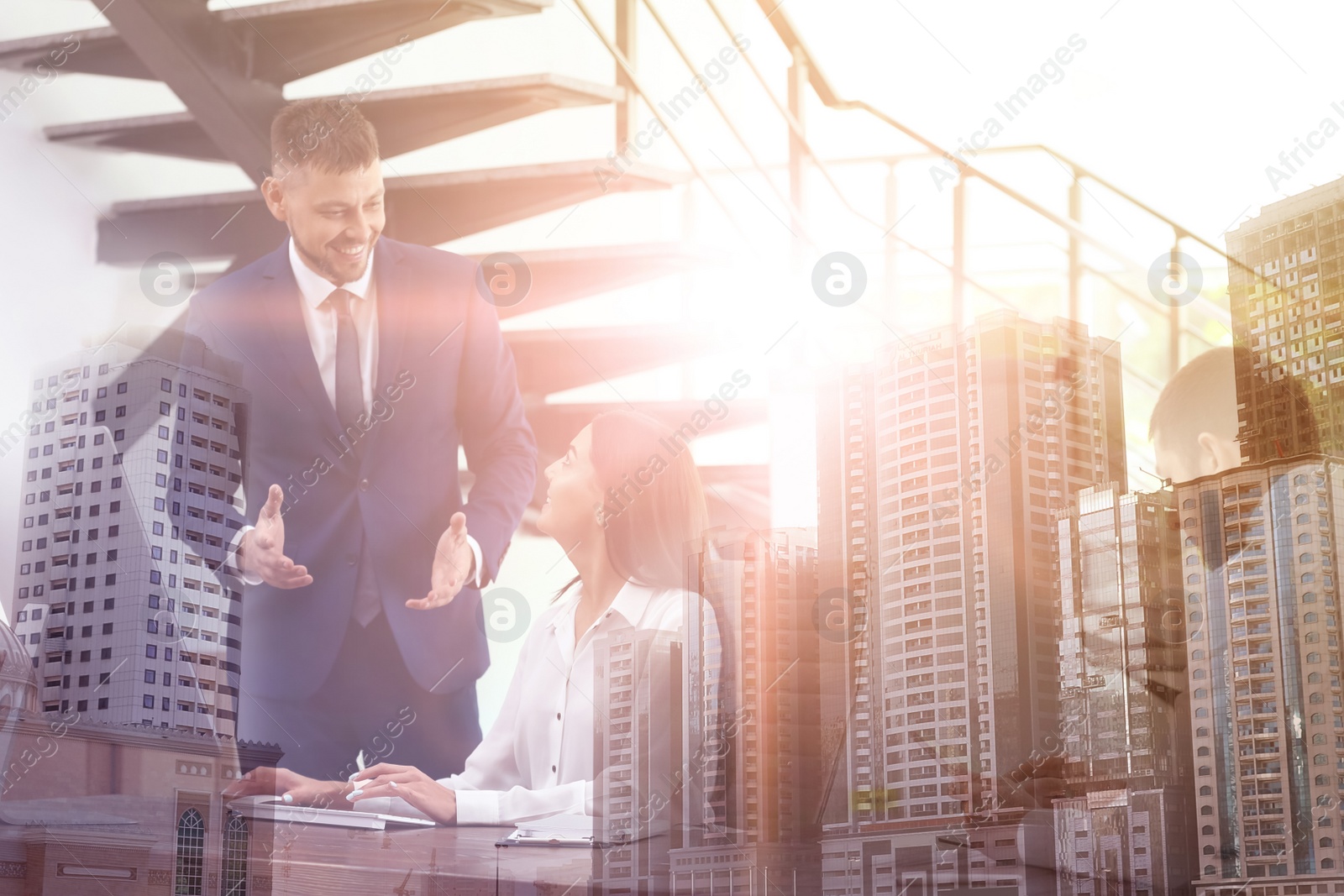 Image of Double exposure of cityscape and man helping his colleague with work in office. Team work 