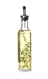 Photo of Cooking oil with thyme in glass bottle isolated on white