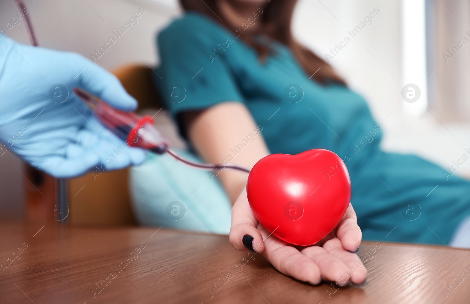 Photo of Teenager donating blood in hospital, closeup view