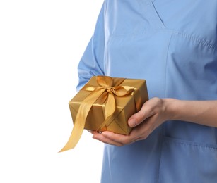 Photo of Doctor holding gift box on white background, closeup. Medical present