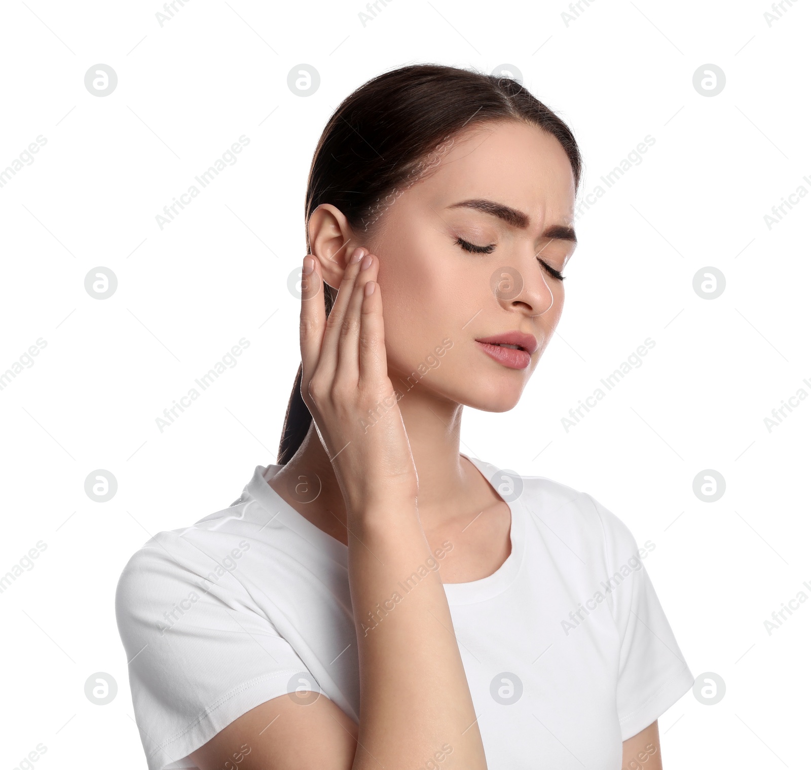 Photo of Young woman suffering from ear pain on white background