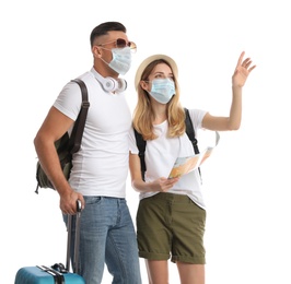 Photo of Couple in face masks with map on white background. Summer travel