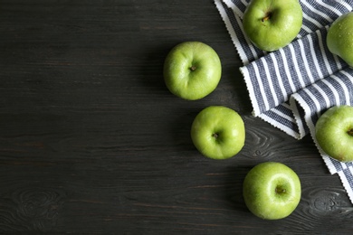 Fresh green apples on wooden background