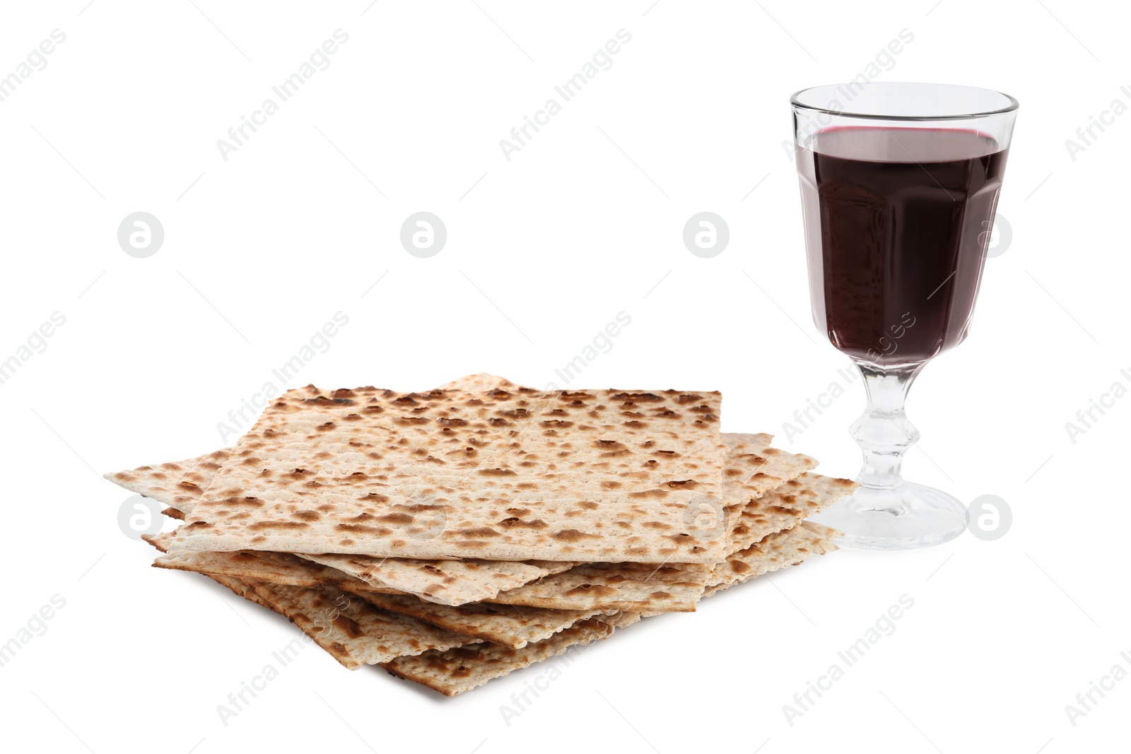 Photo of Traditional matzos and red wine on white background