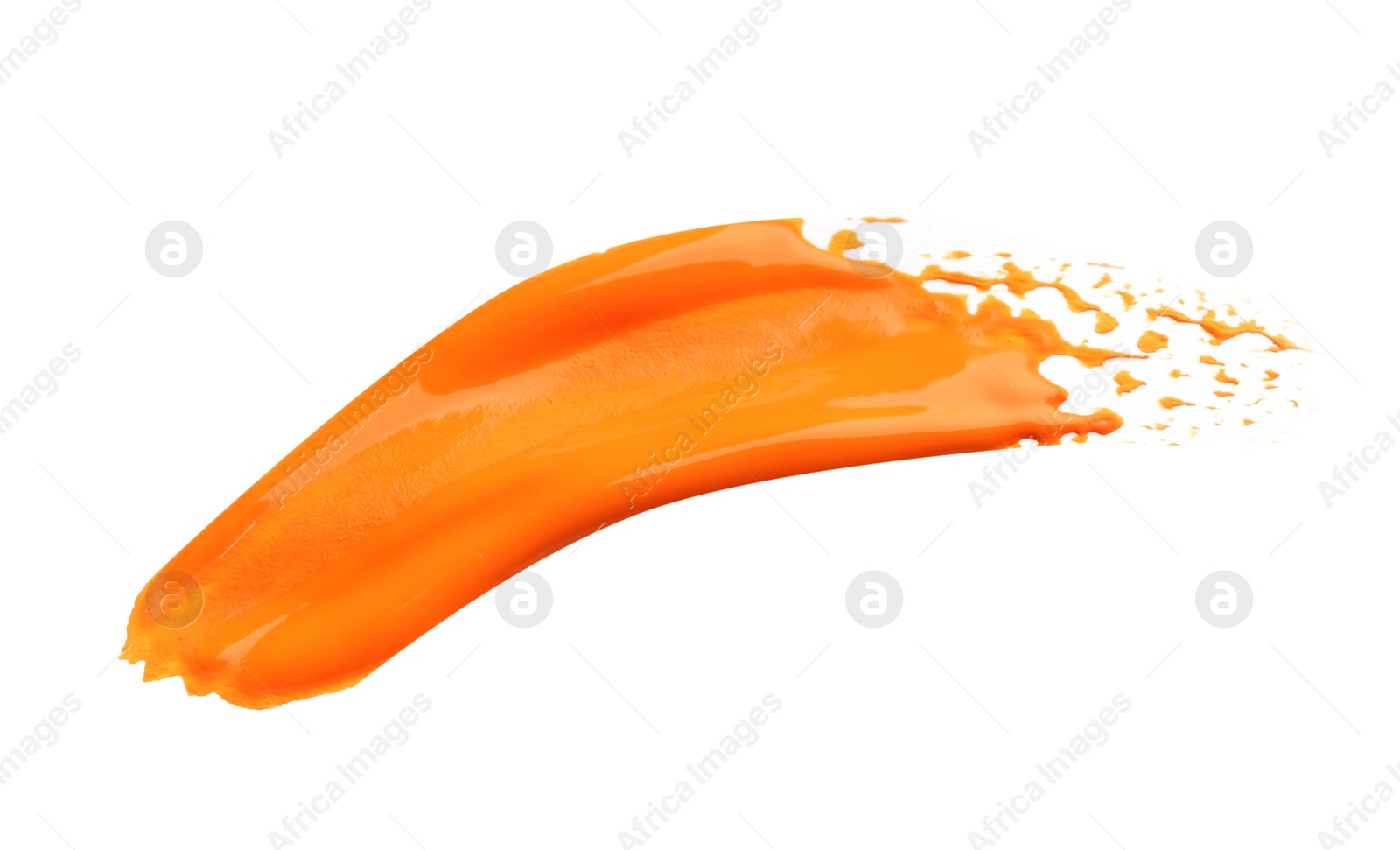 Photo of Abstract brushstroke of orange paint isolated on white